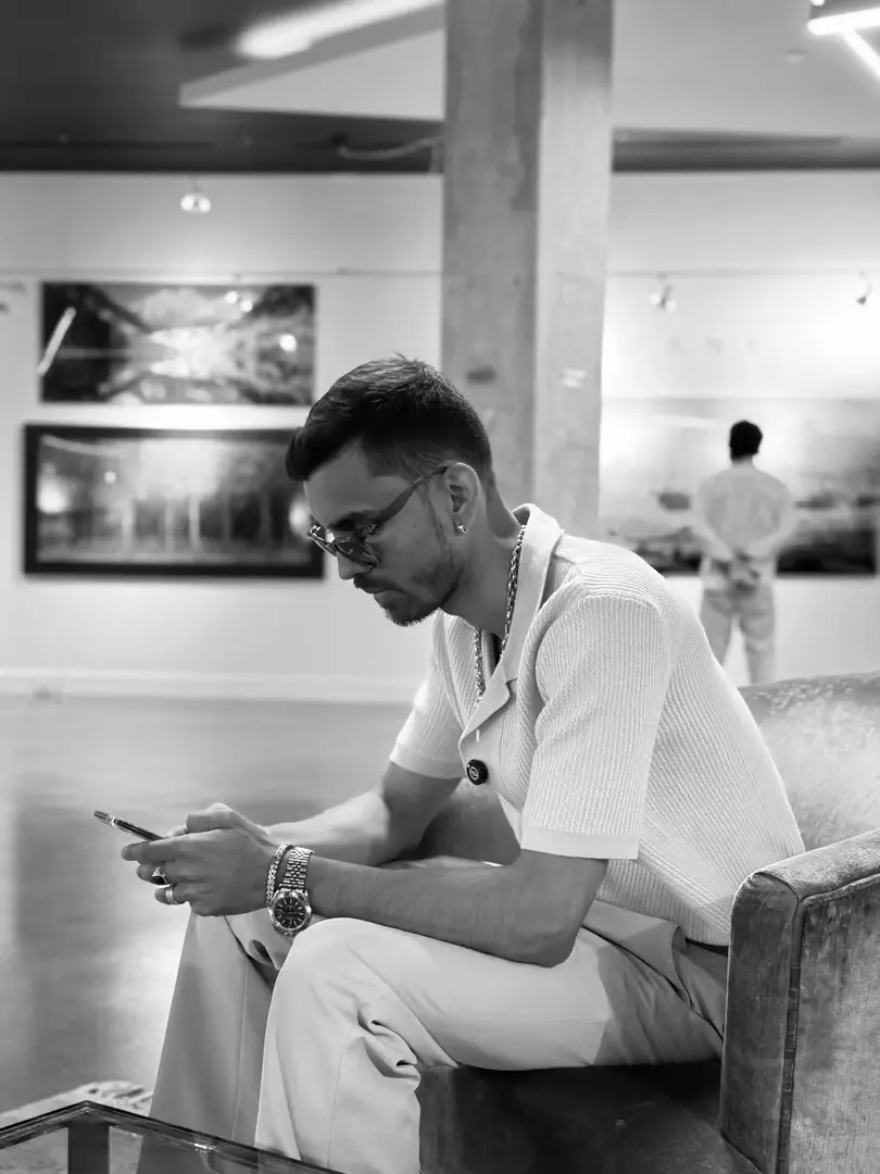 a man wearing a baseball cap and holding a microphone