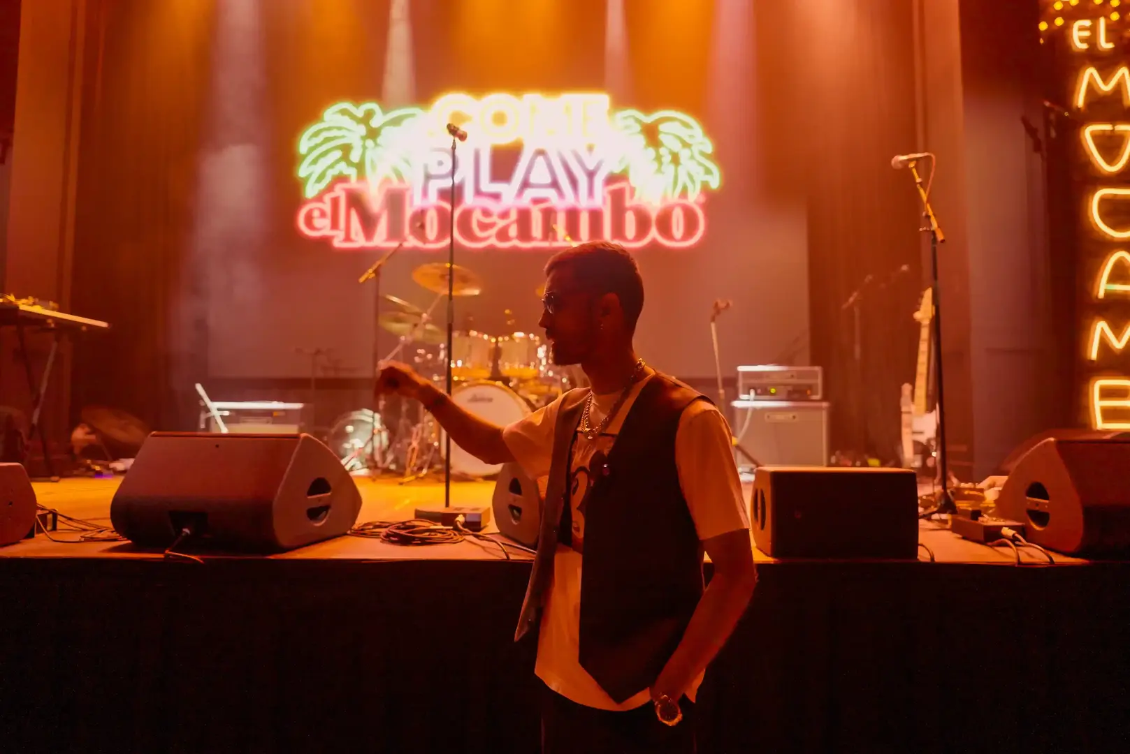 a man sitting in front of a microphone