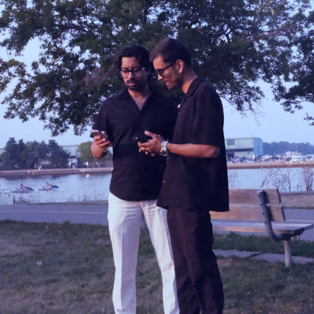 a man in a hat looking at a laptop