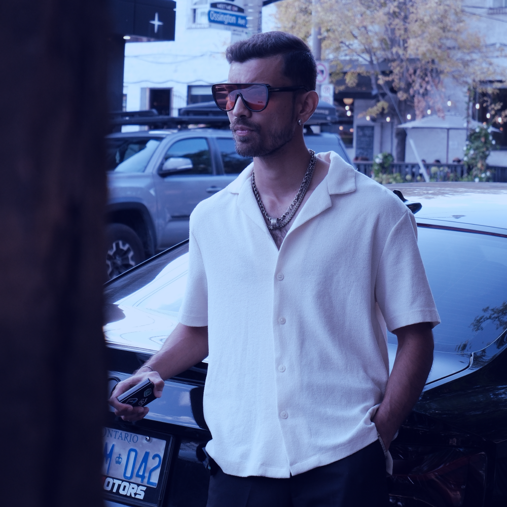a man sitting at a desk with a laptop