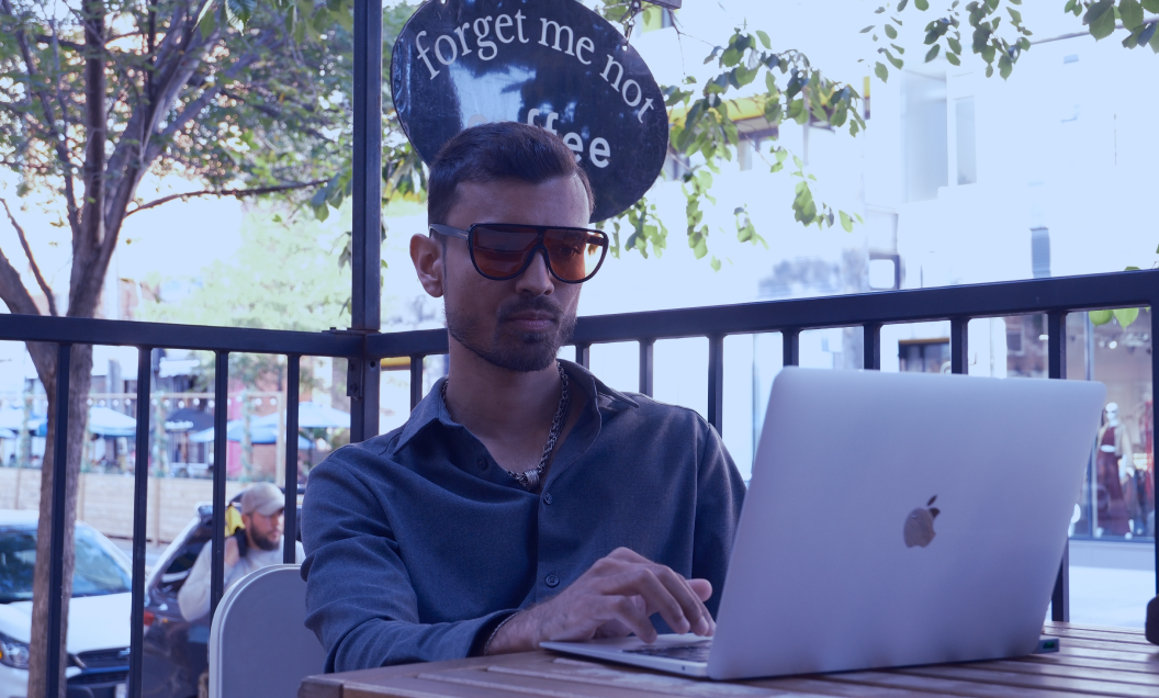 a man writing on a tablet