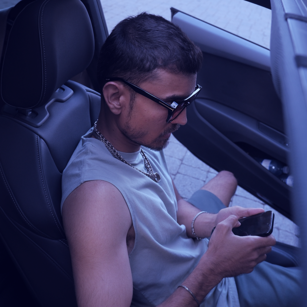 a man wearing a hat and sweater